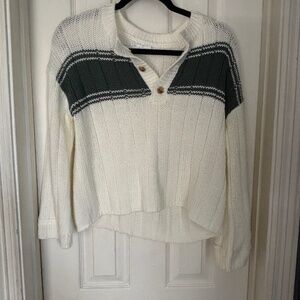 White and green sweater.